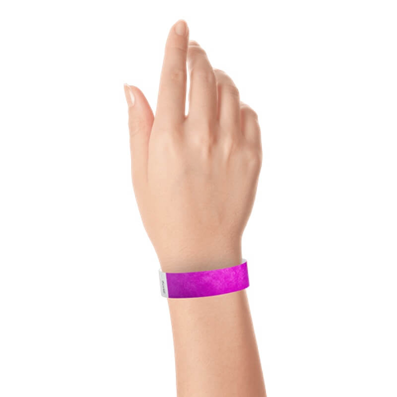 hand wearing a  3/4" tyvek wristband solid pantone purple