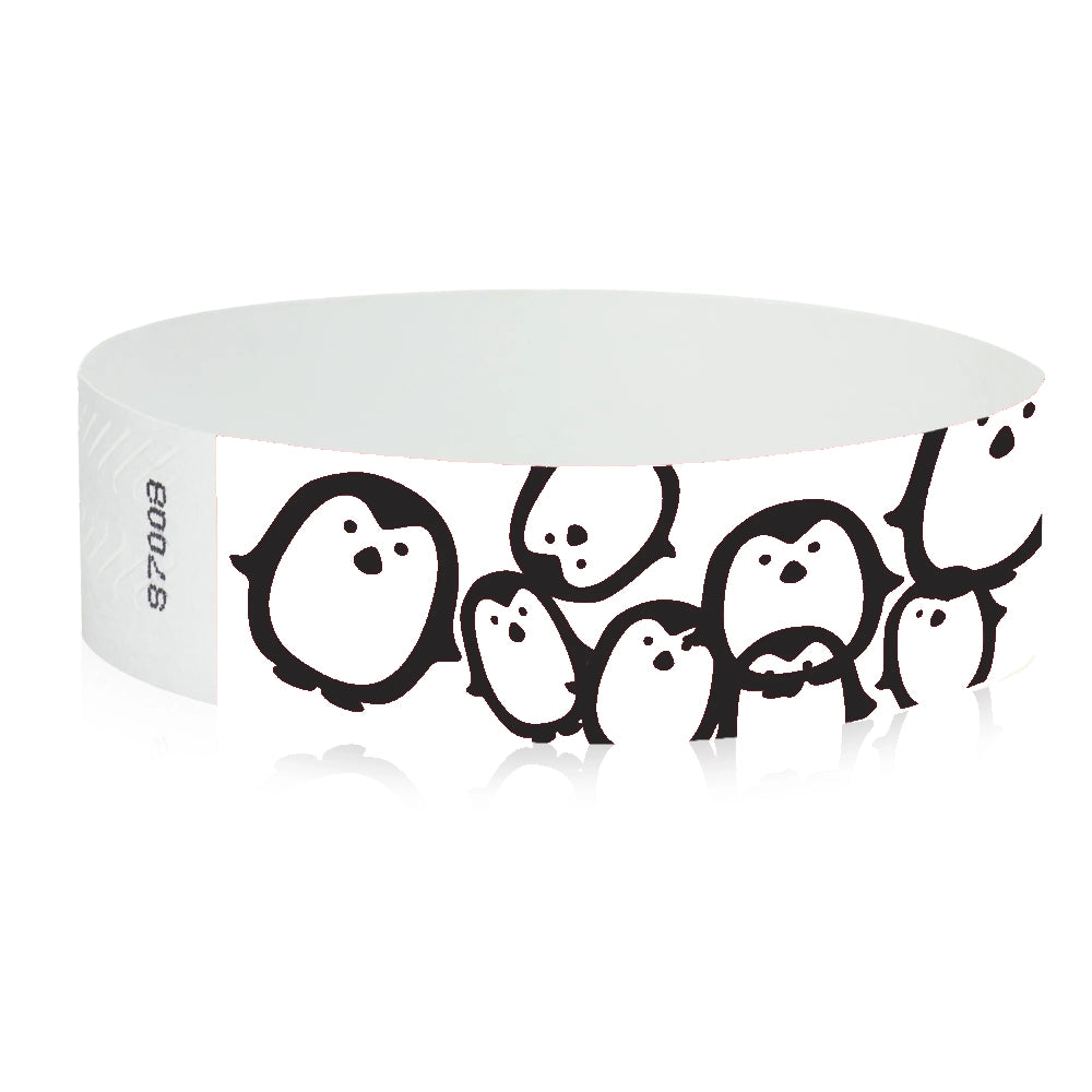 white Tyvek Wristband with black penguins - round version shown
