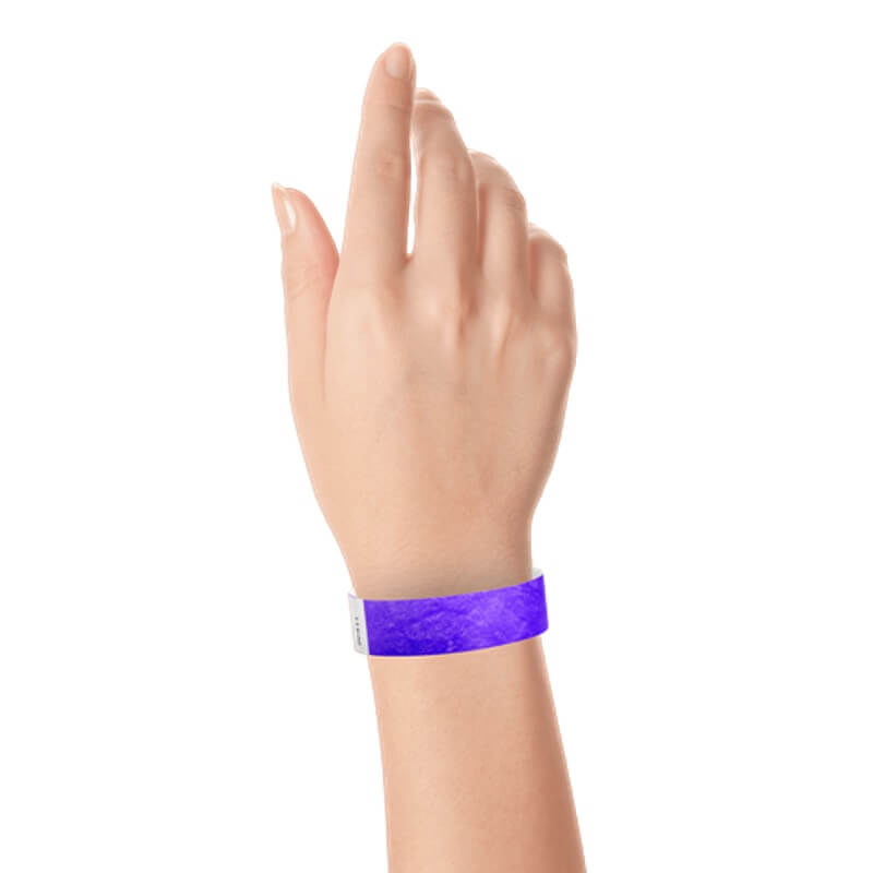 hand wearing a  3/4" tyvek wristband solid purple