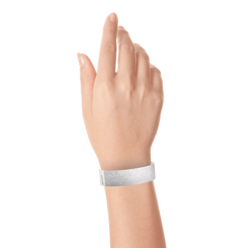 hand wearing a  3/4" tyvek wristband solid silver
