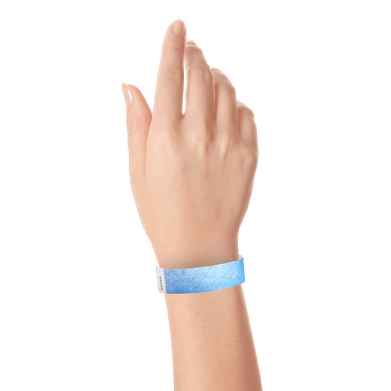 hand wearing a  3/4" tyvek wristband solid sky blue