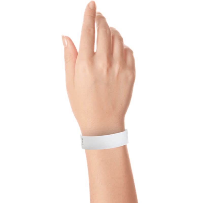 hand wearing a  3/4" tyvek wristband solid white