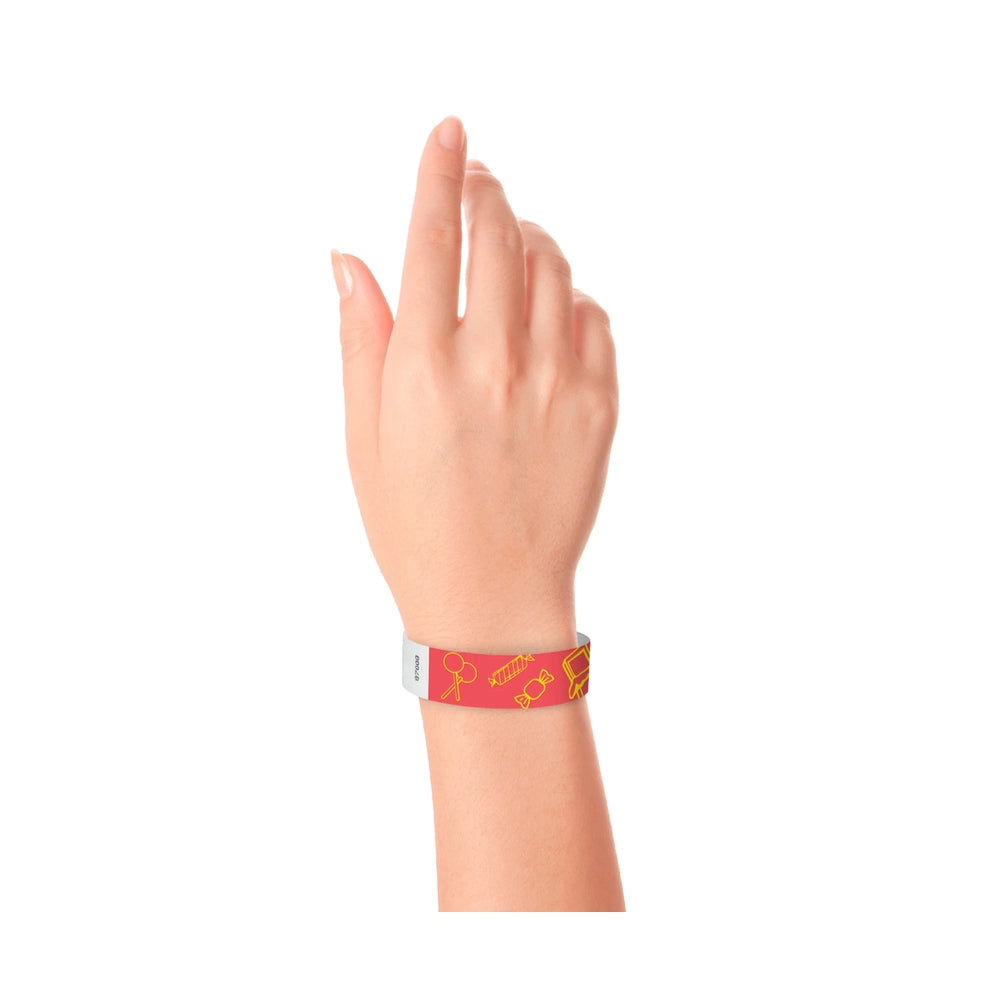 neon Red tyvek wristband with yellow candy illustrations on wrist